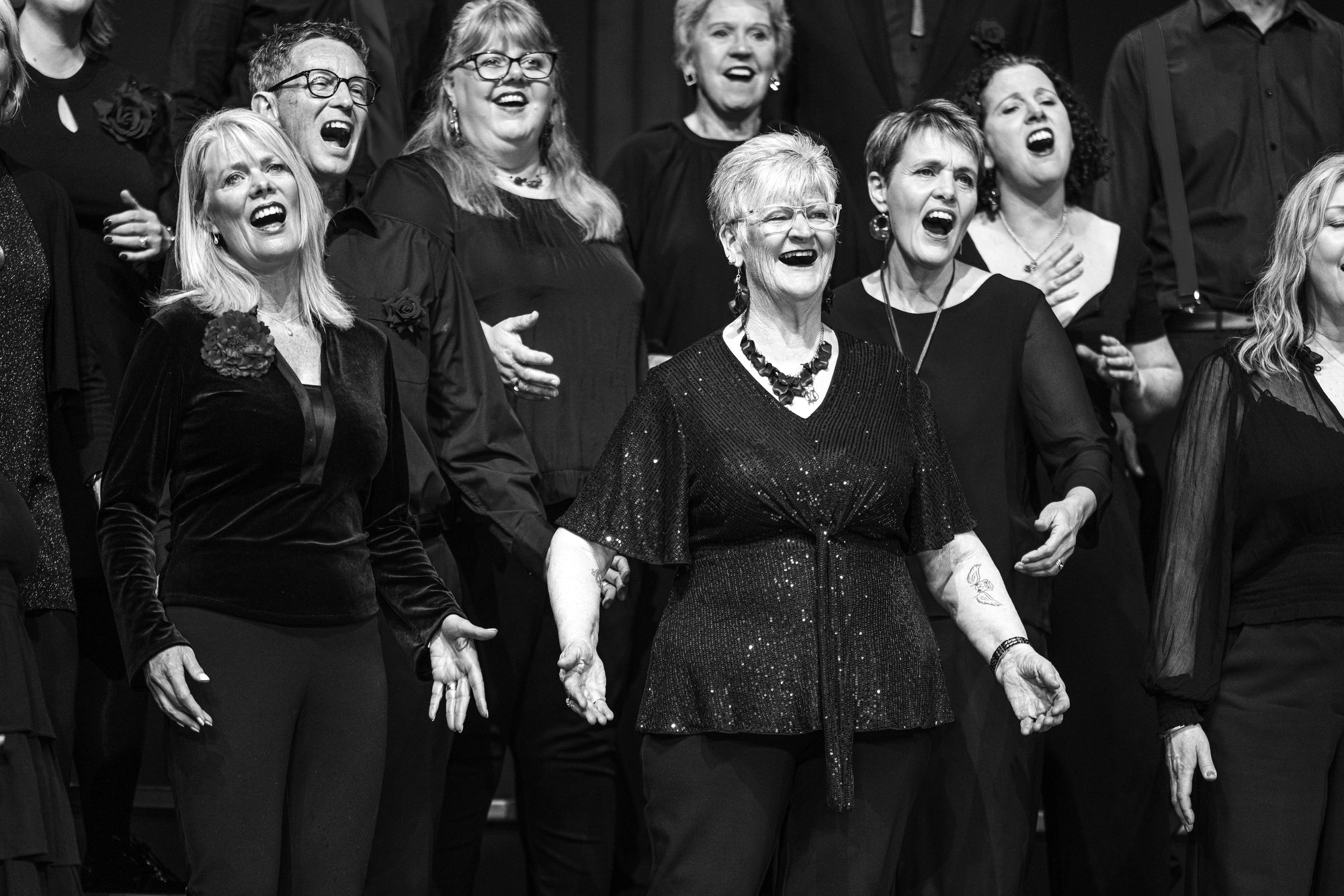 Chorus members mid-song on stage